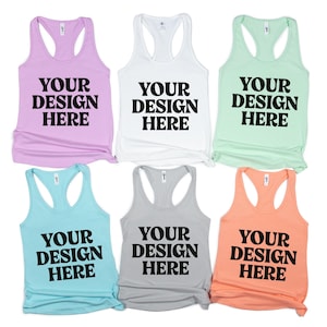 Puede incluir: Seis camisetas sin mangas de colores pastel: lavanda, blanco, verde menta, azul claro, gris y melocotón. Cada camiseta sin mangas presenta el texto "YOUR DESIGN HERE" en letras negras en negrita.