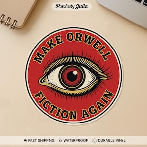 May include: A round sticker with a red background and the text "MAKE ORWELL FICTION AGAIN" in a gold, bold font. The sticker features a detailed eye graphic in the center with a red iris and gold accents. The sticker is waterproof and made of durable vinyl.