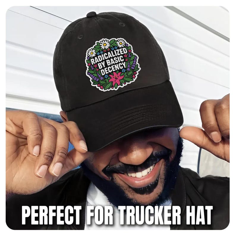 May include: Black baseball cap featuring a floral design and the text "RADICALIZED BY BASIC DECENCY". The cap has a curved peak and an adjustable strap. A classic style hat.