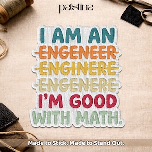 May include: Embroidered patch with the text "I AM AN ENGENEER ENGINERE ENGENERE I'M GOOD WITH MATH." in various colors. The patch has a white border and the text "Made to Stick. Made to Stand Out." is at the bottom.