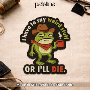 May include: Embroidered patch featuring a grumpy green frog wearing a cowboy hat and red bandana, holding a mug. Text reads "I have to say weird stuff OR I'LL DIE." The patch is black with white and red text, and the frog has a serious expression.