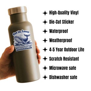 May include: A matte olive green water bottle with a silver lid, featuring a die-cut sticker of a blue whale and the text "Get in, Loser". Additional text on the sticker reads "We're doing God's will. Jonah 1:17".
