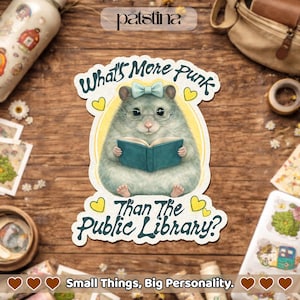 May include: A sticker featuring a cartoon hamster wearing glasses and a bow, reading a book. The sticker has the text "What's More Punk Than The Public Library?" and "Small Things, Big Personality."