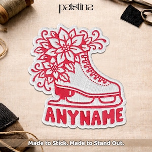 May include: Embroidered patch featuring a white ice skate design with red floral accents. The patch includes the text "ANYNAME" in red, with the words "Made to Stick. Made to Stand Out." at the bottom.