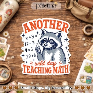 May include: A sticker with a raccoon illustration holding a pencil, with the text "ANOTHER wild day TEACHING MATH." The sticker also includes math equations. The sticker is white with orange and blue text.