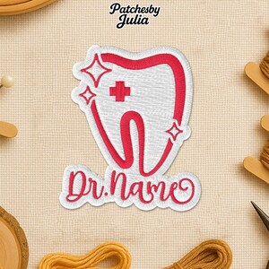 May include: Embroidered patch featuring a stylized tooth design in white and red, with a red cross and star accents. The text "Dr. Name" is written in cursive below the tooth. The patch is likely for dental professionals.