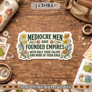 May include: A rectangular sticker with the text "MEDIOCRE MEN HAVE FOUNDED EMPIRES WITH HALF YOUR TALENT AND NONE OF YOUR RAGE." The sticker is decorated with floral illustrations in yellow, pink, and blue. The brand name "patstina" is at the top.