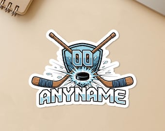 May include: A hockey-themed sticker with a blue and white design. It features crossed hockey sticks, a puck, and a shield with the letters "DD". The word "ANYNAME" is below the hockey sticks. The sticker is labeled "Waterproof" and "Durable Vinyl".
