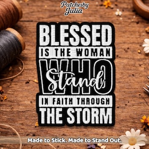 May include: Black and white embroidered patch with the text "BLESSED IS THE WOMAN WHO STAND IN FAITH THROUGH THE STORM." The patch is rectangular and has a bold, stylized font. The patch also has the text "Made to Stick. Made to Stand Out."