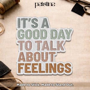 May include: Embroidered patch with the text "IT'S A GOOD DAY TO TALK ABOUT FEELINGS" in various colors. The patch has a white border and is on a textured background. The text "Made to Stick. Made to Stand Out." is at the bottom.
