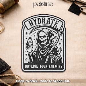 May include: Embroidered patch featuring a black and white Grim Reaper holding a water bottle and scythe. The patch reads "HYDRATE" above the image and "OUTLIVE YOUR ENEMIES" below. The text "Made to Stick. Made to Stand Out." is at the bottom.