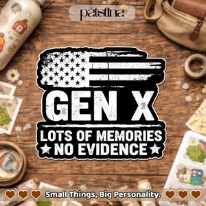 May include: A black and white sticker with an American flag design and the text "GEN X LOTS OF MEMORIES NO EVIDENCE." The sticker is on a wooden surface with other items in the background.