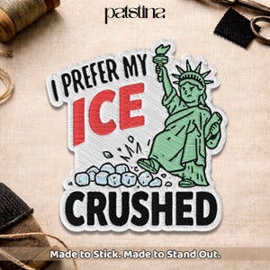 May include: Embroidered patch featuring the Statue of Liberty with the text "I PREFER MY ICE CRUSHED." The patch is white with red, black, and green accents. The phrase "Made to Stick. Made to Stand Out." is at the bottom.