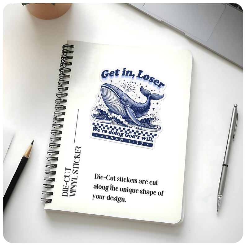 May include: A die-cut vinyl sticker featuring a blue whale illustration with the text "Get in, Loser" and "We're doing God's will. Jonah 1:17." The sticker is on a white spiral-bound notebook. The text "Die-Cut Vinyl Sticker" is printed on the side.