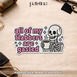 May include: Embroidered patch featuring a skeleton holding a coffee cup, with the phrase "all of my flabbers are gasted" in pink lettering. The patch has a white border and is decorated with small diamond shapes. The text "Made to Stick. Made to Stand Out." is at the bottom.