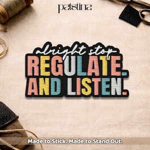 May include: Embroidered patch with the words "abright stop REGULATE AND LISTEN." in white, peach, yellow, and teal on a black background. The patch is on a beige fabric surface. The text "Made to Stick. Made to Stand Out." is at the bottom.