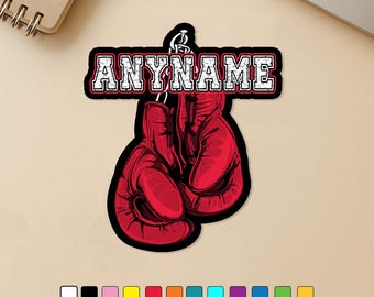 May include: A sticker featuring red boxing gloves with the word "ANYNAME" in white, outlined in black and red. The sticker has a black border and is designed for personalization. The text "Patchesby Julia" is at the top.