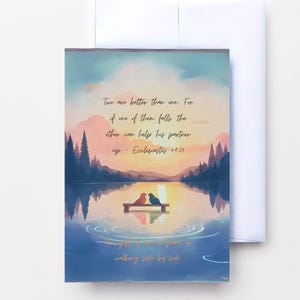 May include: A greeting card featuring a watercolour illustration of a lake scene at sunset. Two birds sit on a bench. Text reads: "Two are better than one. For if one of them falls, the other can help his partner up - Ecclesiastes 4:10."