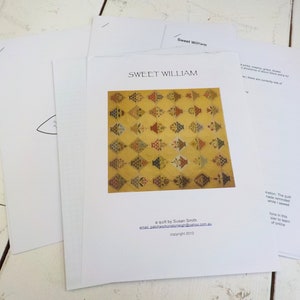May include: A quilt pattern titled "Sweet William" with a colorful patchwork design featuring a repeating pattern of small flower pots. The pattern is by Susan Smith and includes her email address and copyright information.