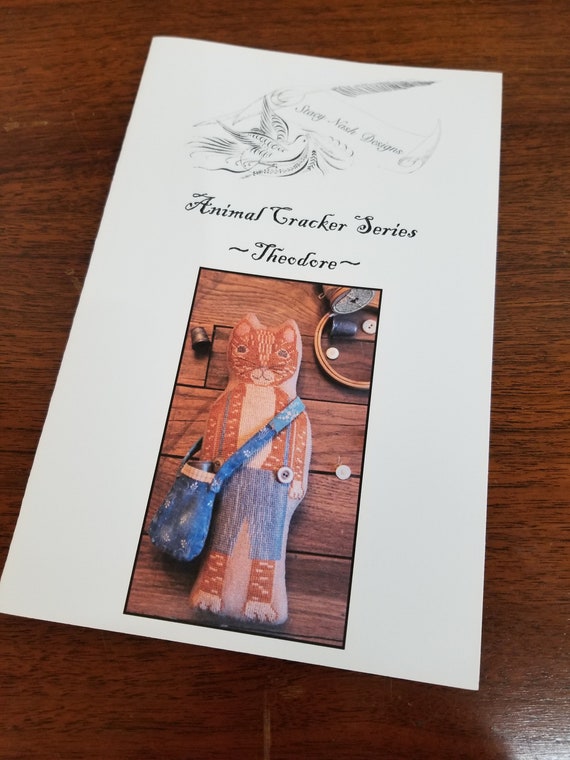 Theodore, Animal Crackers Series by Stacy Nash Primitives...cross stitch chart, cat
