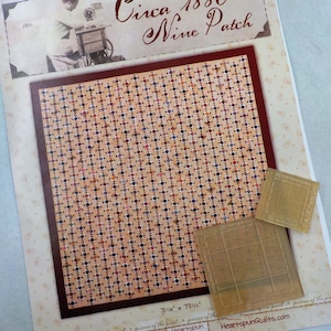 May include: A quilt pattern design titled "Circa 1880 Nine Patch" with a red border and a beige background. The pattern is made up of small squares in various shades of red, brown, and white. The design is 71 1/8 inches by 77 1/4 inches and is designed by Pam Buda.