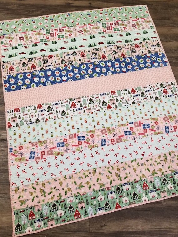 Christmas Stripes quilt kit...pattern designed by Mickey Zimmer, features Christmas novelty prints, Christmas DIY, beginner quilt kit