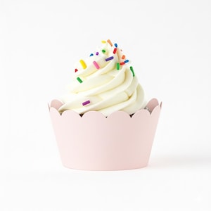 May include: A cupcake with white icing and colourful sprinkles in a light pink, scalloped paper case. The cupcake is centred against a white background, providing a clean and simple presentation.