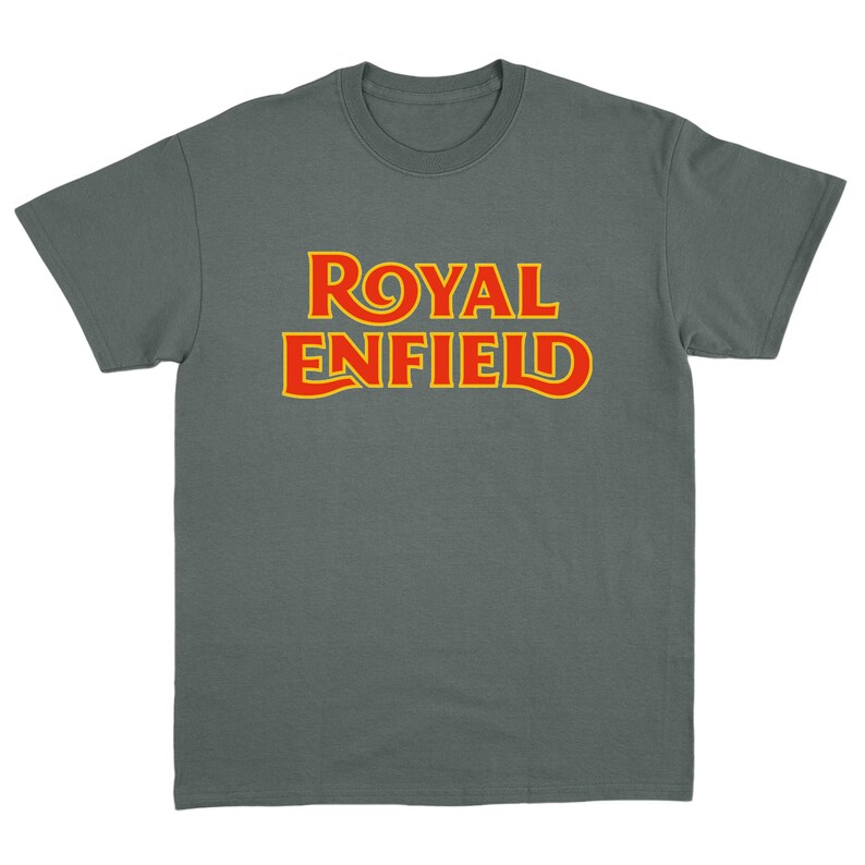 May include: A charcoal gray short-sleeve t-shirt featuring the text ROYAL ENFIELD printed in bold red letters with a yellow outline across the chest. The garment has a crew neckline and a standard fit, showcasing the brand logo clearly.