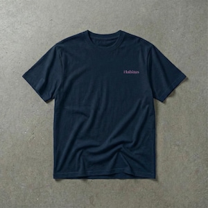 May include: Navy blue t-shirt with the word "Habitus" printed in a pinkish-purple color on the upper right chest area. The shirt is made of a soft material and has short sleeves and a crew neck.