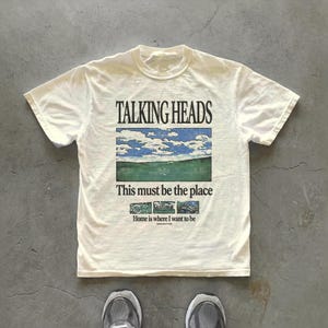 Talking Heads graphic t-shirt inspired by “This Must Be the Place” — unisex regular fit tee with artistic music storytelling.