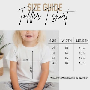 May include: A size guide for a toddler t-shirt featuring a white shirt with a black diagram showing width and length. A table lists sizes 2T, 3T, 4T, and 5/6T with corresponding width and length measurements in inches. The text reads SIZE GUIDE and Toddler T-shirt.