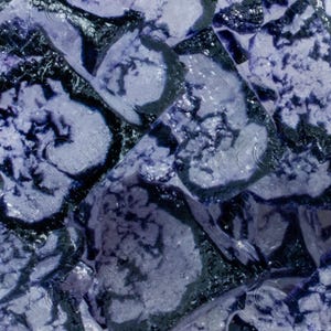 May include: Abstract mosaic pattern in shades of blue and grey. The design features irregular, geometric shapes with a textured, almost crystalline appearance. The overall effect is cool and modern.