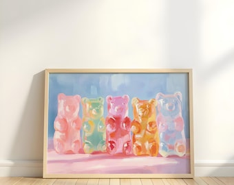 May include: A framed art print featuring five colorful gummy bear candies. The bears are in shades of pink, green, red, orange, and blue, set against a light blue and pink background. The artwork is displayed in a light-colored wooden frame.