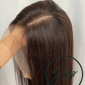 May include: A straight, dark brown wig featuring a lace front construction with a visible parting line. The hair is smooth and falls straight down. A circular logo with the text YSP CRAFTS is visible in the lower right corner.