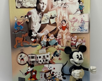 May include: A rectangular ceramic tile featuring a collage of Disney characters and Walt Disney. The tile includes images of Mickey Mouse, Pluto, Snow White, and the Seven Dwarfs. A Mickey Mouse figurine is attached to the tile.