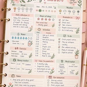 May include: A daily planner page with floral accents, featuring sections for mood, weather, sleep, schedule, to-do lists, water intake, exercise, money tracking, and meal planning. The page includes text like Daily Planner, Good Things Take Time, and Notes.