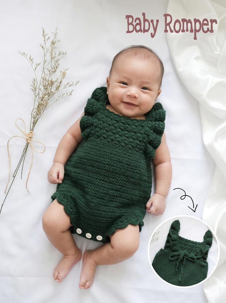May include: A dark green crocheted baby romper featuring ruffled shoulder straps, a textured bodice, and a scalloped leg opening. The garment includes three small white buttons at the bottom. The text "Baby Romper" is visible in the upper right corner.