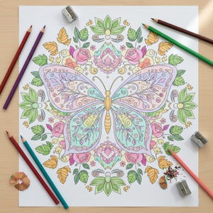 May include: A detailed butterfly coloring page with a floral mandala design, featuring pastel colors. Colored pencils in various shades of red, purple, green, and brown surround the page, along with two pencil sharpeners and pencil shavings.