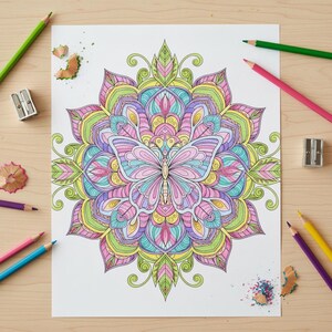 May include: A detailed, colorful butterfly mandala coloring page with a variety of colored pencils and sharpeners scattered around it. The mandala features a butterfly in the center, with pink, blue, yellow, and green hues. The pencils are green, pink, yellow, and purple.