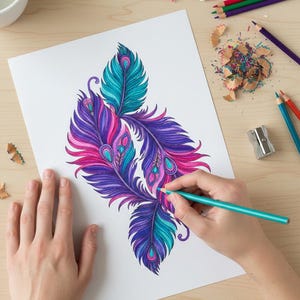 A lifestyle preview of a person's hands coloring a detailed arrangement of peacock feathers with a turquoise pencil. This 60-page collection showcases high-quality bohemian line art featuring vibrant purple, magenta, and teal patterns. The scene is set on a light wooden desk with art supplies, perfect for promoting adult relaxation, mindful meditation, and printable Zen activities