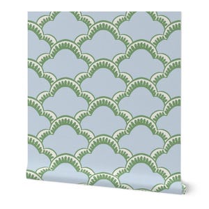 May include: A roll of wallpaper featuring a repeating pattern of light blue, white, and green scalloped shapes. The design has a layered, textured appearance, creating a visually interesting surface.