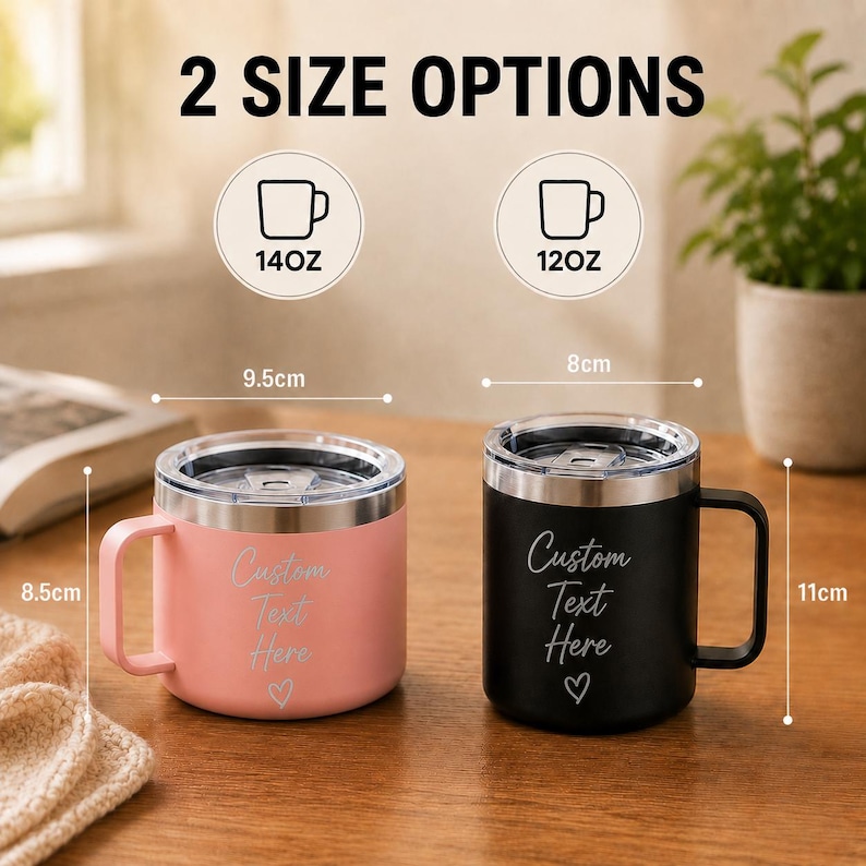 May include: Two stainless steel mugs with clear lids and handles, one pink and one black, each featuring the text Custom Text Here and a heart icon. The pink mug is 9.5cm wide by 8.5cm high, and the black mug is 8cm wide by 11cm high, with 14oz and 12oz options.