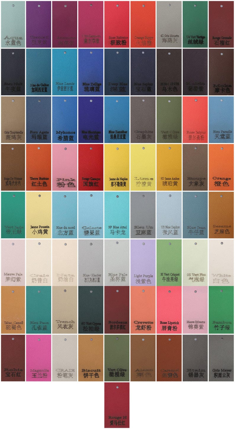 May include: A color swatch chart featuring a variety of hues, including blues, greens, reds, and yellows. Each swatch is rectangular with a small hole at the top, and includes text.