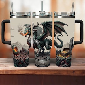 May include: A set of three insulated travel mugs with black handles and silver lids. Each mug features a detailed illustration of a green dragon with wings, armor, and a treasure chest. The name "Max" is printed on one of the mugs.