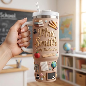 May include: A tan insulated tumbler with a handle and straw featuring raised 3D school-themed icons including books, pencils, an apple, a ruler, a calculator, a globe, and a chalkboard. The text reads Mrs Smith In My Teacher Era in gold.