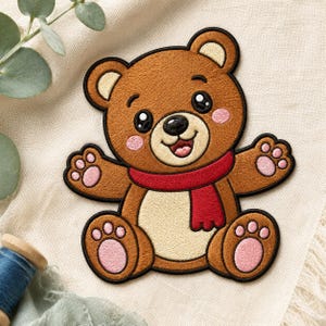 May include: An embroidered patch of a brown teddy bear with a cream-colored belly, wearing a red scarf. The bear has black eyes, a black nose, a smiling mouth, and pink accents on its cheeks, ears, and paw pads, all outlined in black thread.