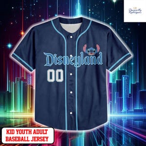 A blue baseball jersey with the word "Disneyland" printed on it, featuring a cartoon character. The jersey is displayed against a colorful, starry background.