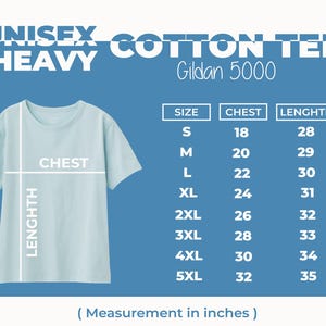 May include: A light blue unisex cotton tee shirt with the text "UNISEX COTTON TEE HEAVY" and "Gildan 5000". The shirt has a size chart with chest and length measurements in inches: S (18, 28), M (20, 29), L (22, 30), XL (24, 31), 2XL (26, 32), 3XL (28, 33), 4XL (30, 34), 5XL (32, 35).