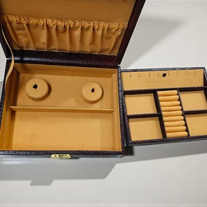 Luxury leather jewelry organizer with multiple compartments and ring slots
