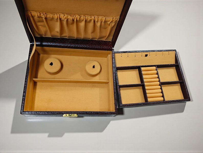 Luxury leather jewelry organizer with multiple compartments and ring slots